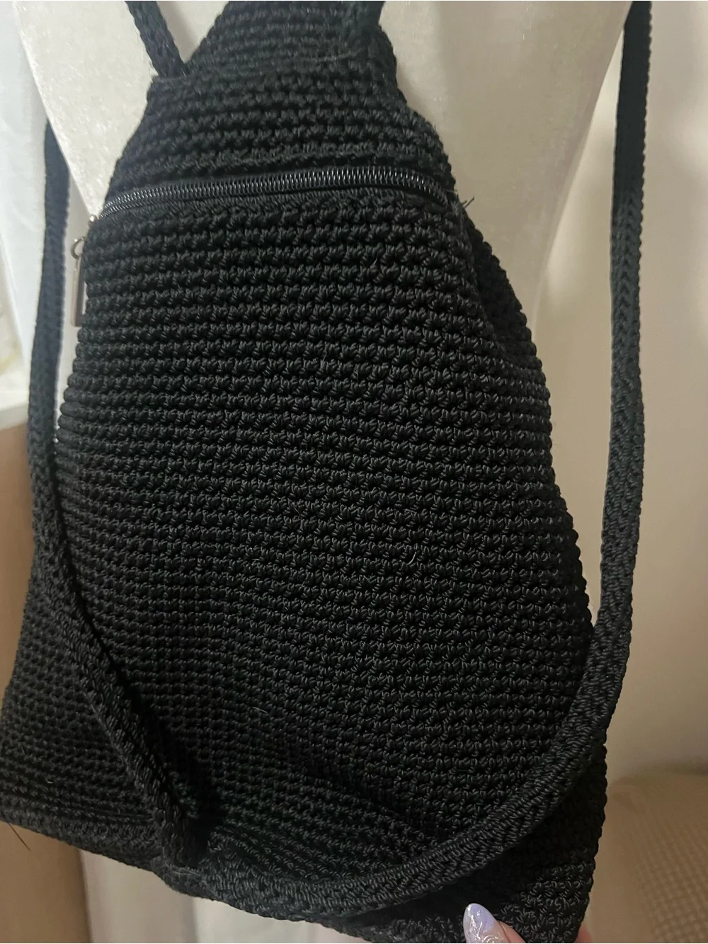 The Sak Black Knit Drawstring Backpack with Pink Floral Charm